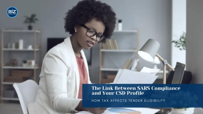 Business owner checking CSD profile online to ensure SARS compliance for tenders in South Africa.