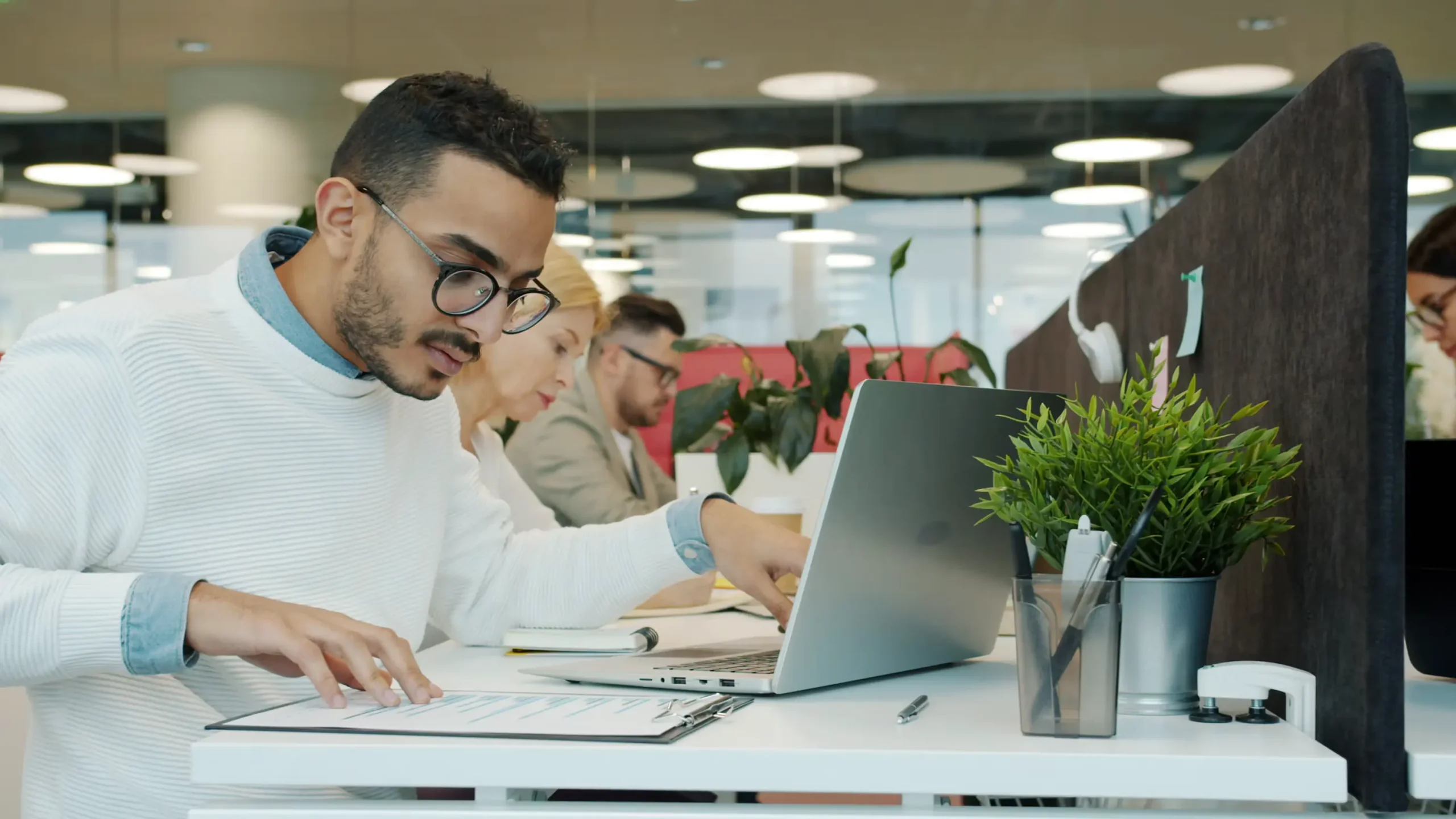 Accountant reviewing bookkeeping records and financial reports on a laptop