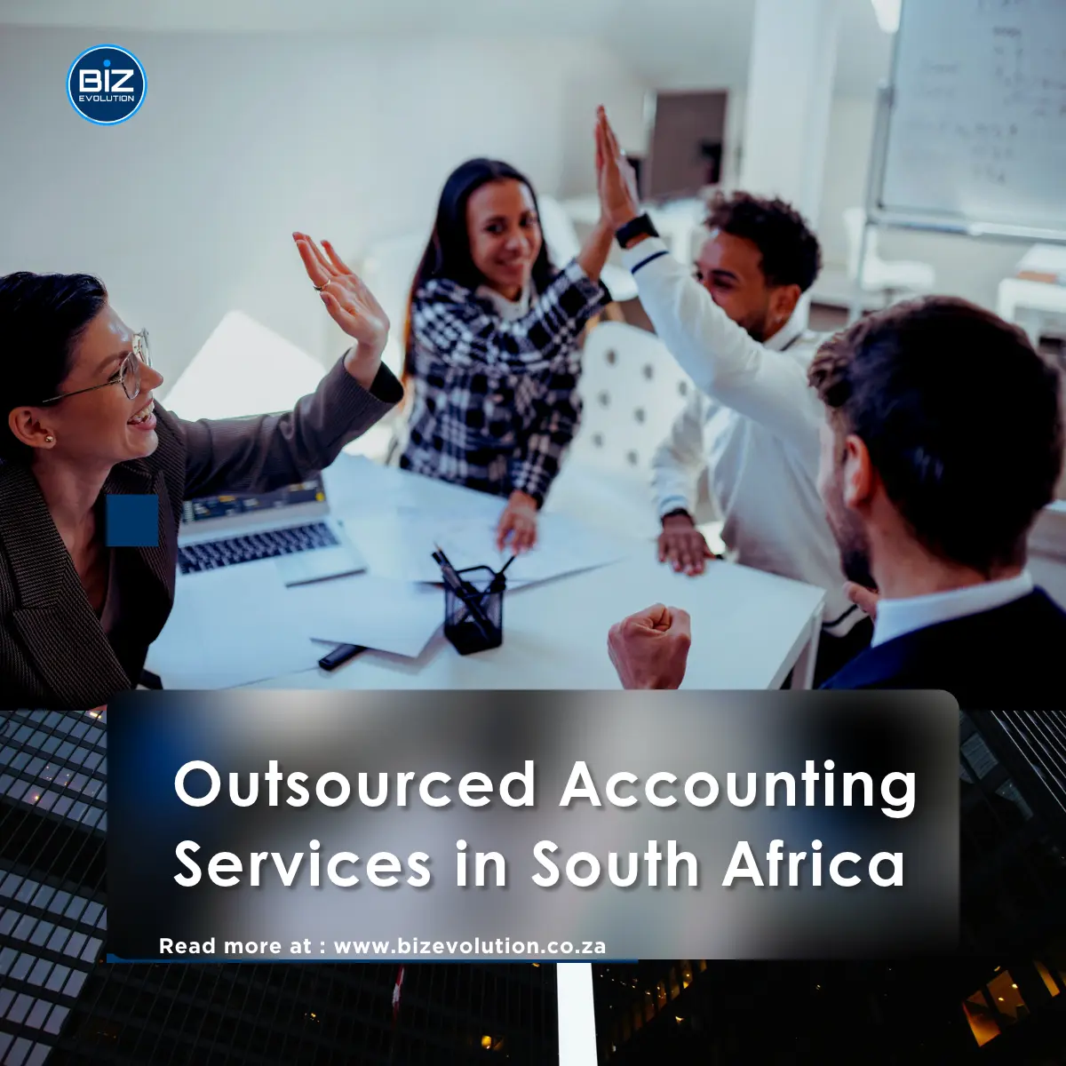 South African business owner reviewing financial reports with an outsourced accounting professional.